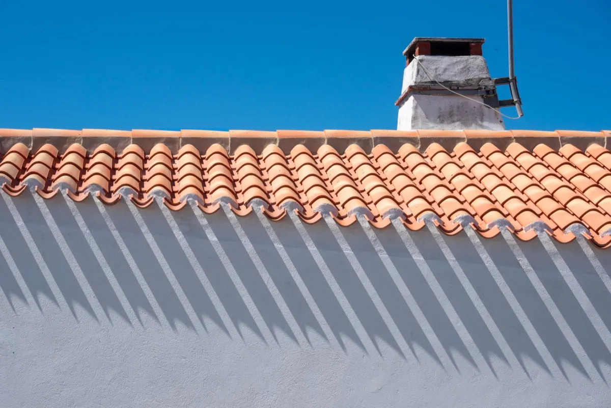 Roof ridge line and chimney on a home in Redding, CA